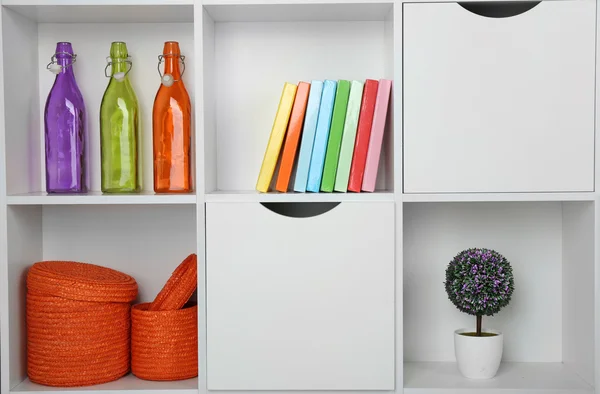 Beautiful white shelves with different home objects — Stock Photo, Image