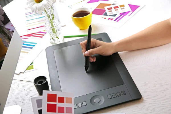 Artist drawing on graphic tablet in office — Stock Photo, Image