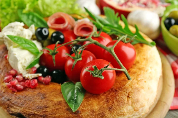 Ingredients of Mediterranean cuisine, on wooden board, close-up — Stock Photo, Image