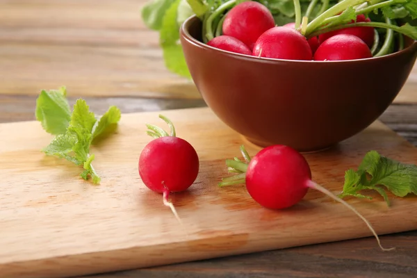 Fresh red radish on wooden table, closeup — Stock Photo, Image