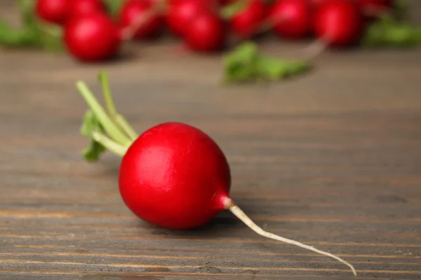 Fresh red radish on wooden table, closeup — Stock Photo, Image