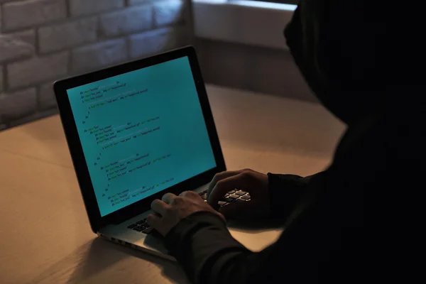 Hacker with laptop — Stock Photo, Image