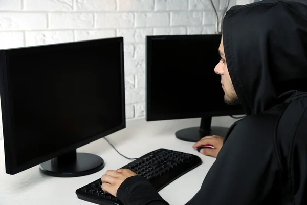 Hacker with computers in room — Stock Photo, Image