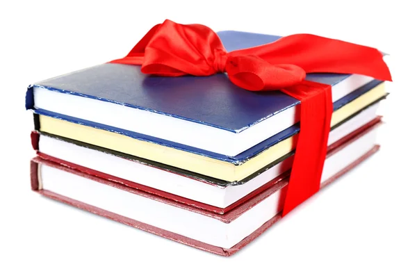 Stack of books with ribbon isolated on white — Stock Photo, Image