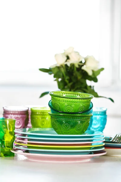 Clean plates, glasses and cutlery on white table — Stock Photo, Image