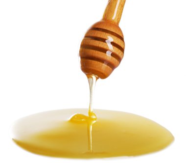 Kepçe ışık yüzeyi üzerinden damlayan bal