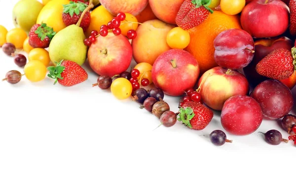 Heap of fresh fruits and berries  isolated on white — Stock Photo, Image