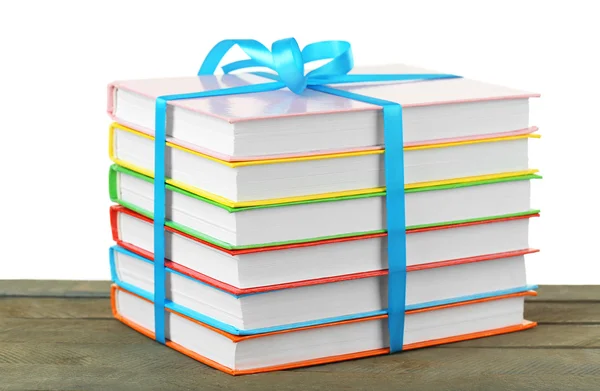 Montón de libros con cinta sobre fondo claro — Foto de Stock