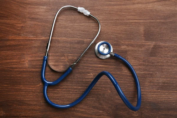 Stethoscope fából készült háttér — Stock Fotó