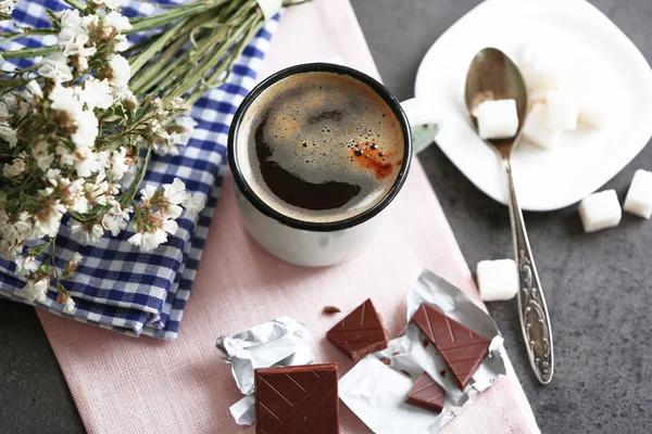 Cup of flavored coffee with chocolate on table with napkin, closeup — Stock Photo, Image