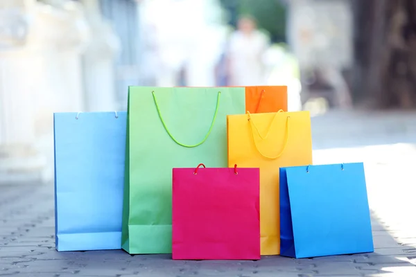 Bright shopping bags outdoors — Stock Photo, Image