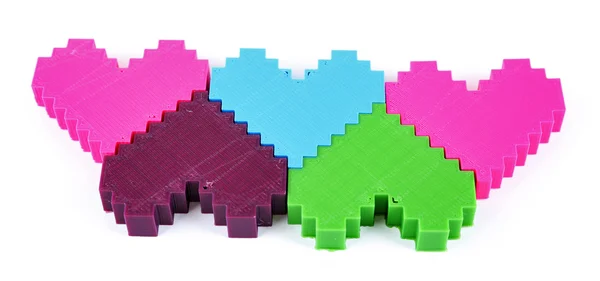 Plastic puzzle hearts isolated on white — Stock Photo, Image