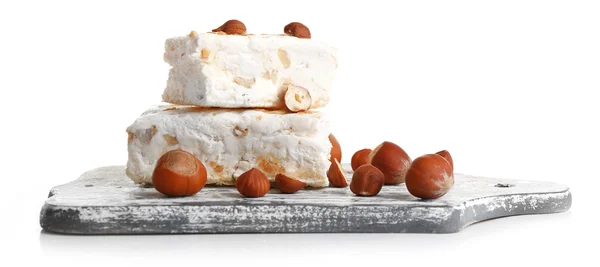 Zoete nougat met hazelnoten geïsoleerd op wit — Stockfoto