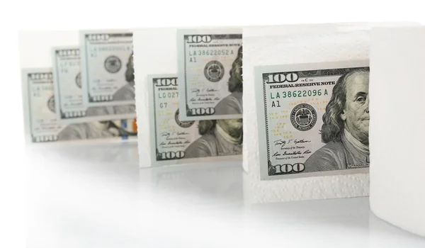 White rolls of toilet paper and dollar banknotes on light background — Stock Photo, Image