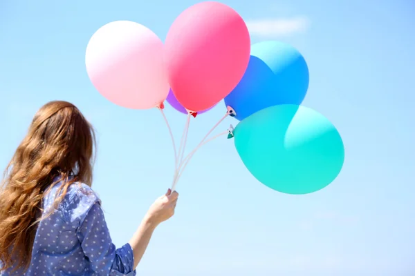 Girl with colorful balloons — Stock Photo, Image