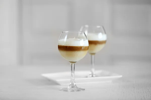 Wine glass with jelly on light background — Stock Photo, Image