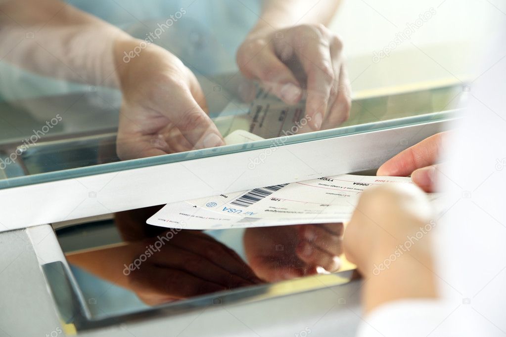 Woman buying tickets at box office