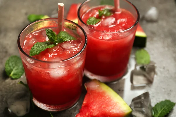 Cold watermelon drinks in glasses, on dark background — Stock Photo, Image