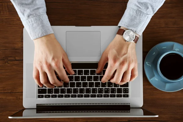 Man working with laptop, top view — Stock Photo, Image