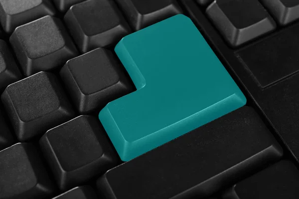 Клавиатура ноутбука с зеленой кнопкой — стоковое фото