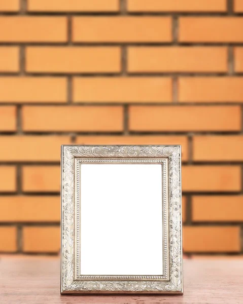 Old empty frame standing on table — Stock Photo, Image