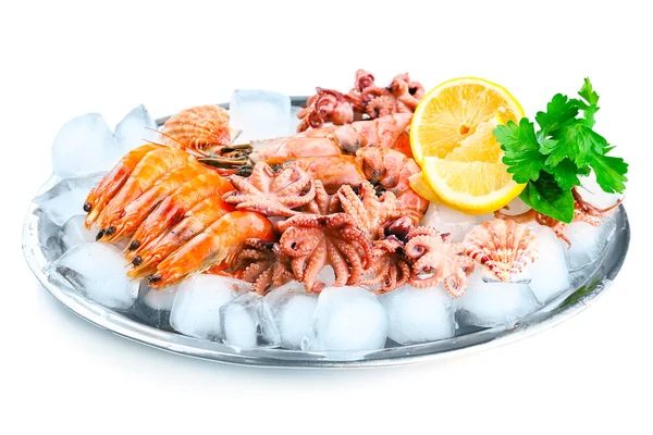 Seafood with lemon and ice on metal tray isolated on white — Stock Photo, Image
