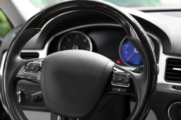 Modern car illuminated dashboard and steering wheel — Stock Photo, Image