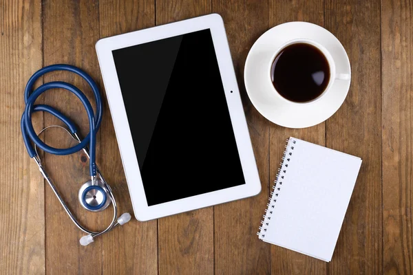 Doctor workplace with tablet and stethoscope — Stock Photo, Image