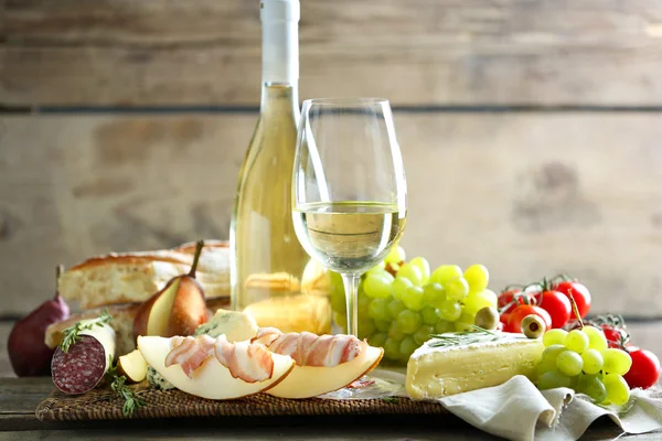 Still life with various types of Italian food and wine