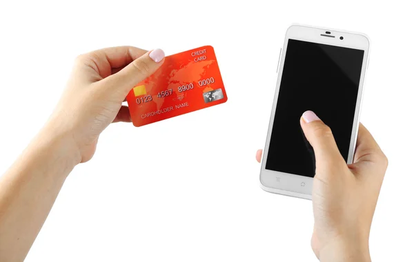 Женщины держат в руках смартфон и кредитную карту, изолированные на белом — стоковое фото