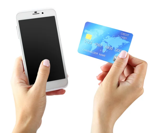 Manos femeninas con teléfono inteligente y tarjeta de crédito, aisladas en blanco — Foto de Stock