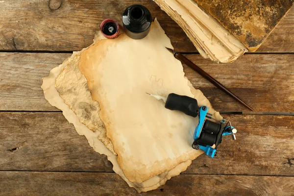 Machine for tattoo with old paper — Stock Photo, Image