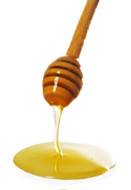 Kepçe ışık yüzeyi üzerinden damlayan bal