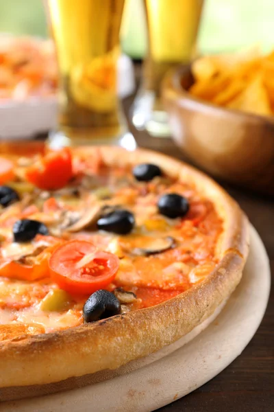 Pizza served with beer — Stock Photo, Image