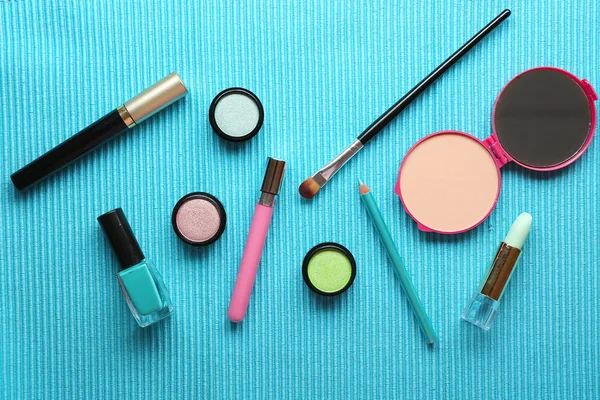 Different cosmetics on blue background — Stock Photo, Image