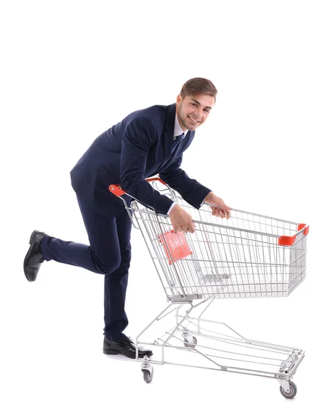 Young man with empty shopping cart — Stock Photo, Image