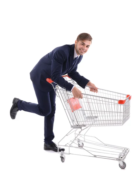 Young man with empty shopping cart Stock Image