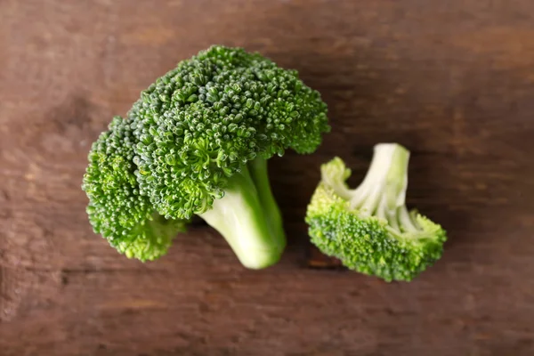 Fresh broccoli on wooden background — Stock Photo, Image