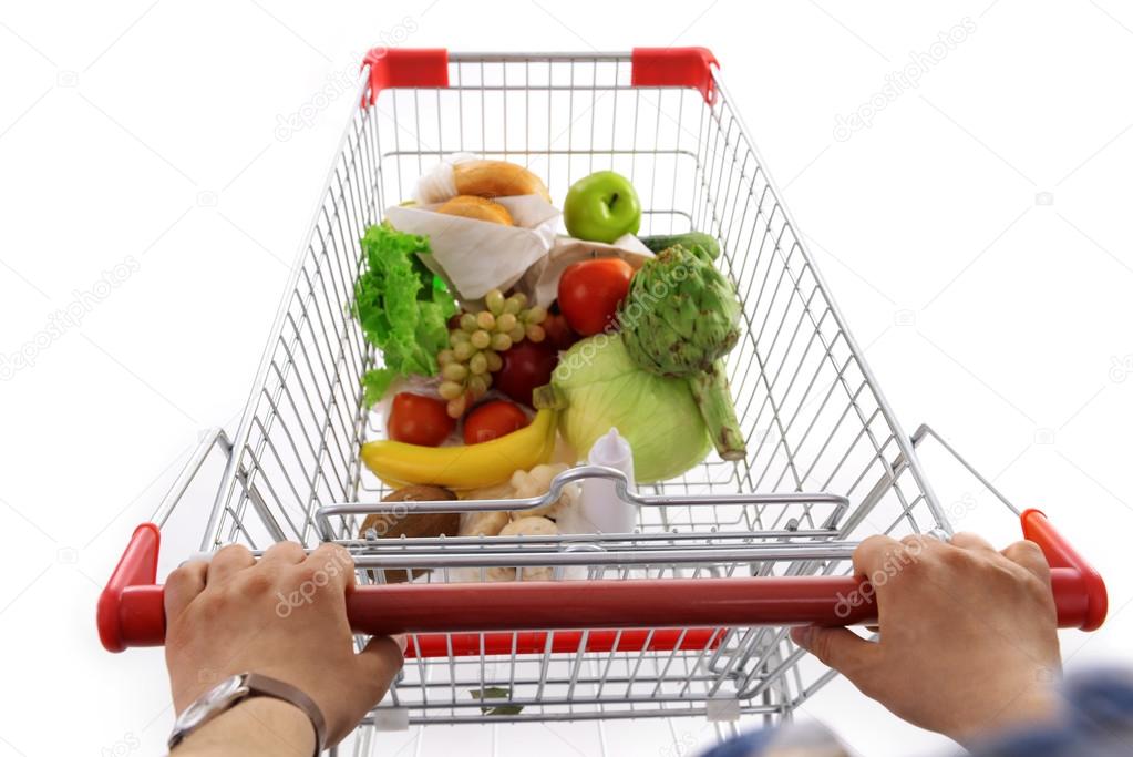 Young man with shopping cart