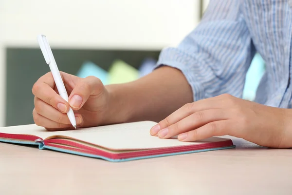 Woman write on notebook — Stockfoto