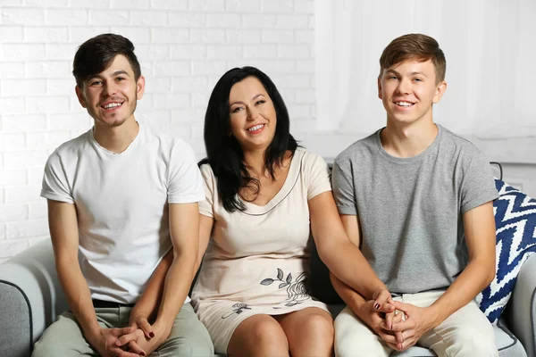 Happy family portrait on sofa at home — Stock Photo, Image