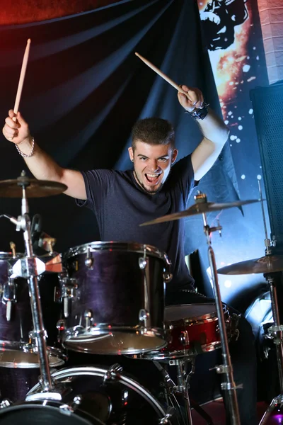 Drummer on dark background — Stock Photo, Image
