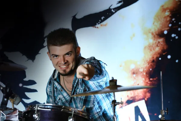 Excited drummer on bright background — Stock Photo, Image