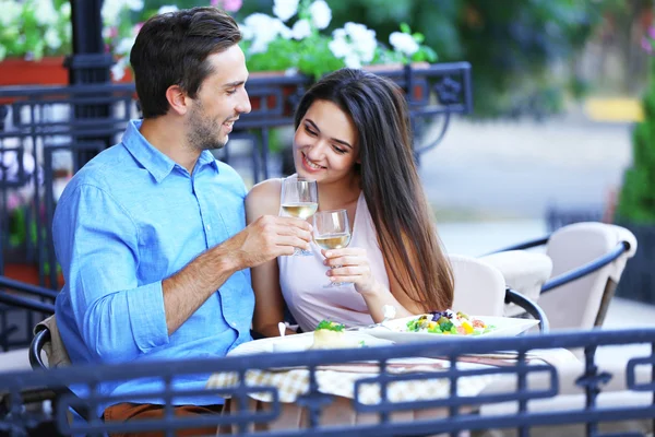 Young couple in street cafe — Stock Photo, Image