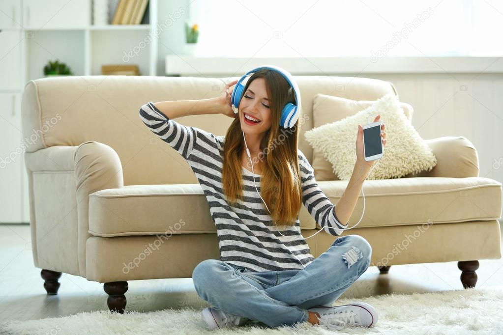 Woman listening music in headphones