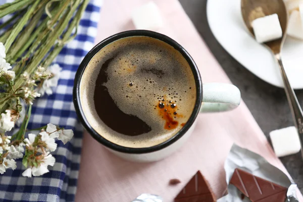 Cup of flavored coffee with chocolate on table with napkin, closeup — Stock Photo, Image