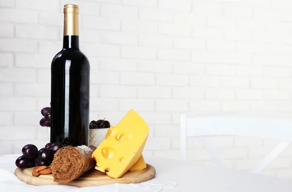 Set of products with wine bottle on light background