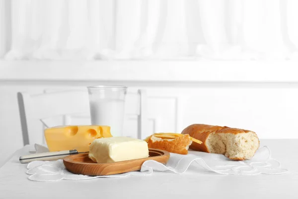 Fresh bread with cheese and butter — Stock Photo, Image