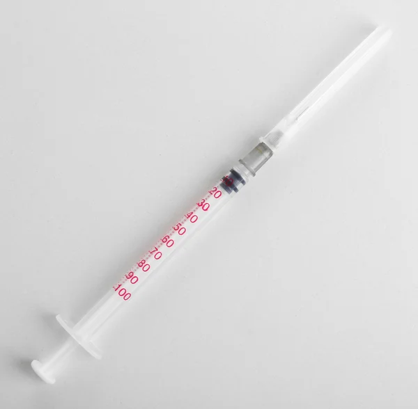 Medical syringe on white — Stock Photo, Image