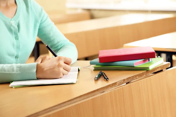 Female hand writing in notebook — Stock Photo, Image